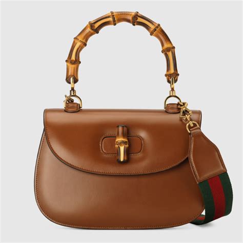 brown gucci bag with bamboo handle|gucci bamboo bag harper's.